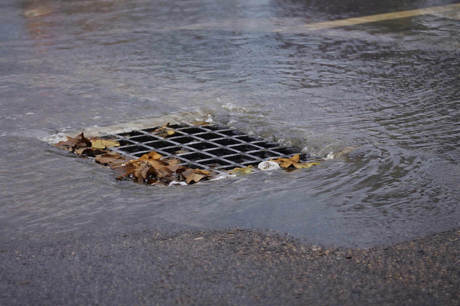 Storm drain collecting runoff from industrial surface drainage system